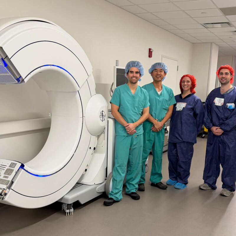 Dr. Daniel E. Choi (center) and Dr. Justin B. Ledesma (left) with the O-arm™ Imaging System at Good Samaritan University Hospital in West Islip, N.Y. Dr. Choi was the first surgeon to utilize the system at the hospital during a minimally invasive navigated TLIF procedure on February 23, 2026.
