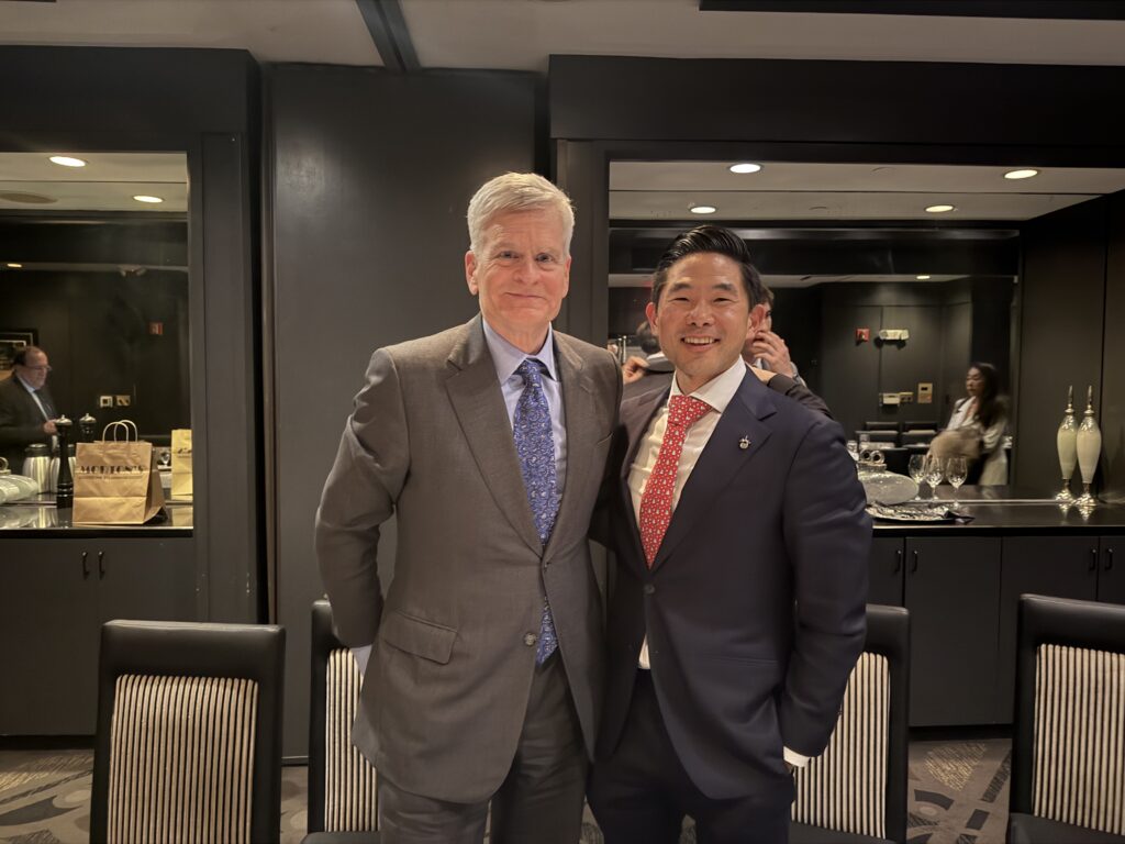 Dr. Daniel Choi and Senator Bill Cassidy speaking at a healthcare forum in Great Neck.