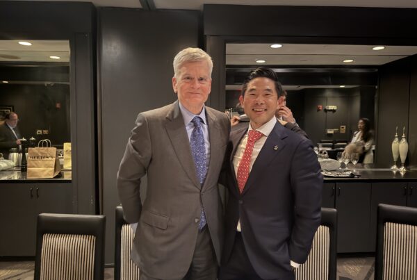 Dr. Daniel Choi and Senator Bill Cassidy speaking at a healthcare forum in Great Neck.
