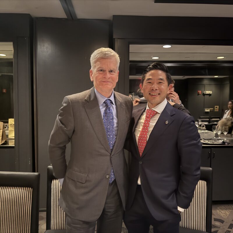 Dr. Daniel Choi and Senator Bill Cassidy speaking at a healthcare forum in Great Neck.