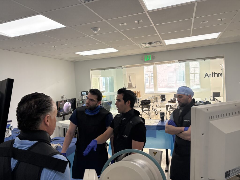 Dr. Justin Ledesma speaking with Yale New Haven Hospital residents about spine endoscopy and minimally invasive spine surgery
