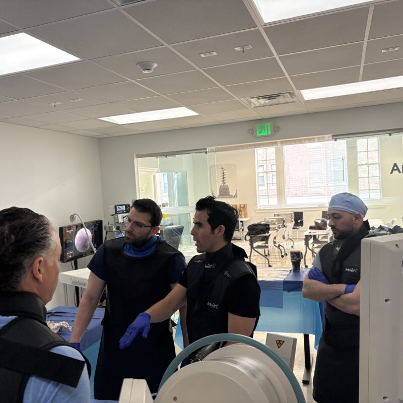 Dr. Justin Ledesma speaking with Yale New Haven Hospital residents about spine endoscopy and minimally invasive spine surgery