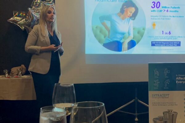 Dr. Antigone Argyriou presenting educational content on vertebrogenic low back pain treatment.